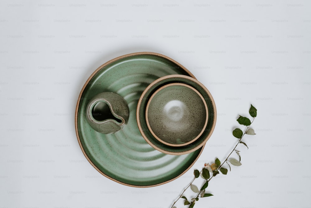 a couple of bowls sitting on top of a plate