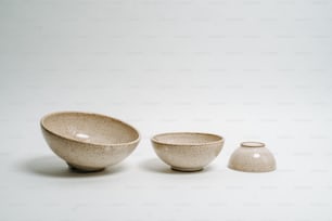 a couple of bowls sitting next to each other