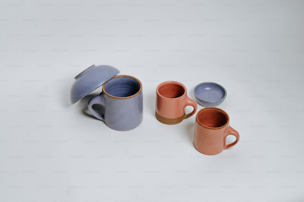 a group of three cups sitting next to each other