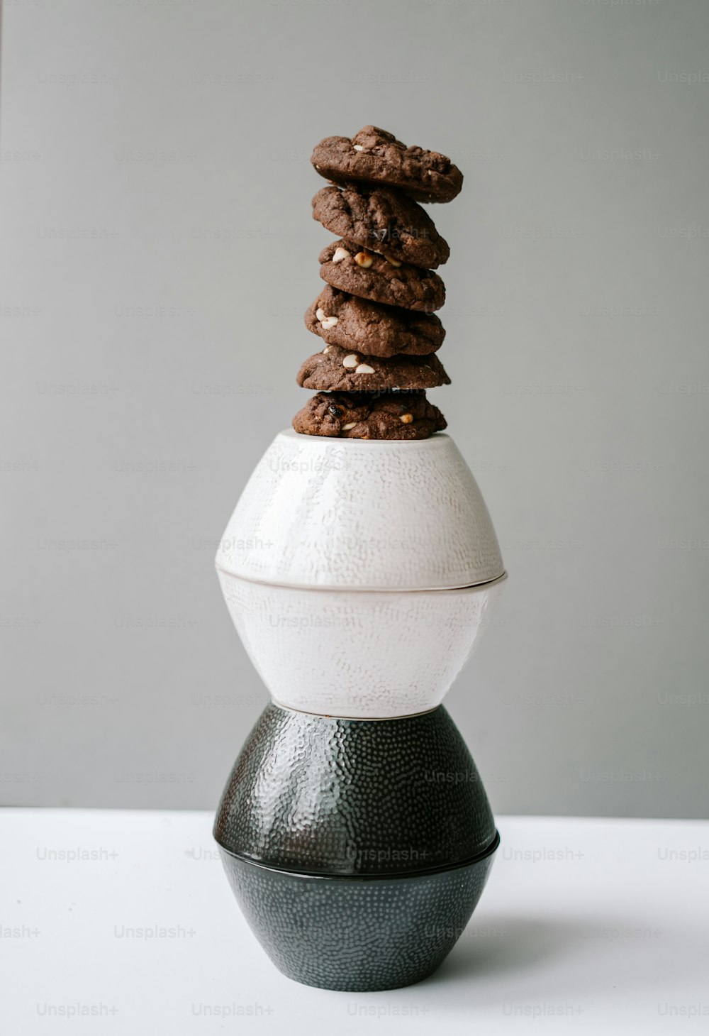 a stack of cookies sitting on top of an egg