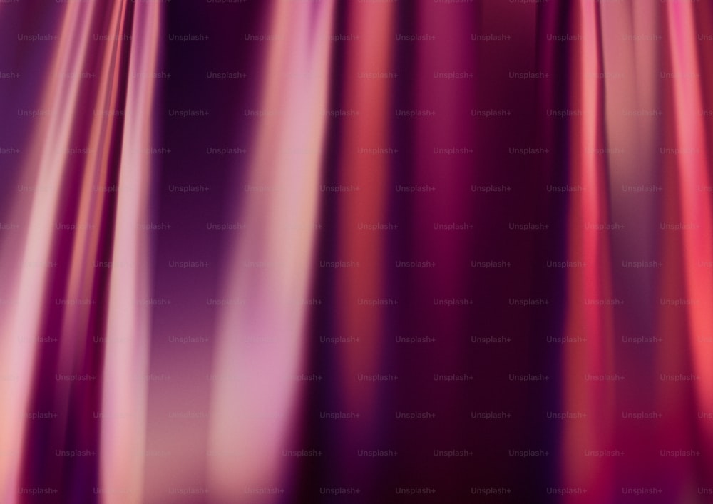 a close up of a curtain with a red and pink color