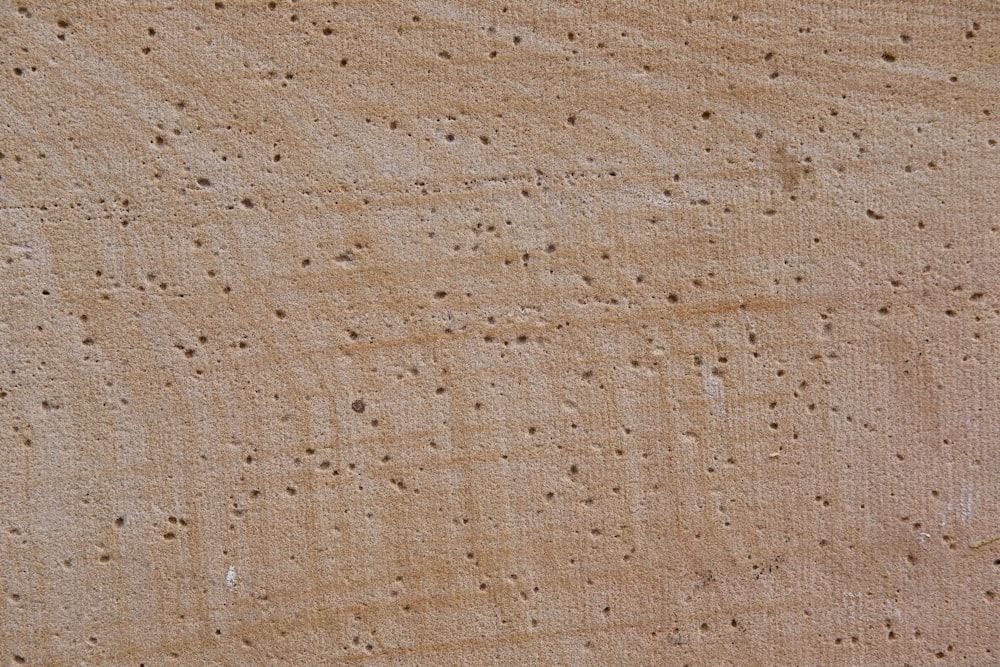 a close up of a wall with holes in it