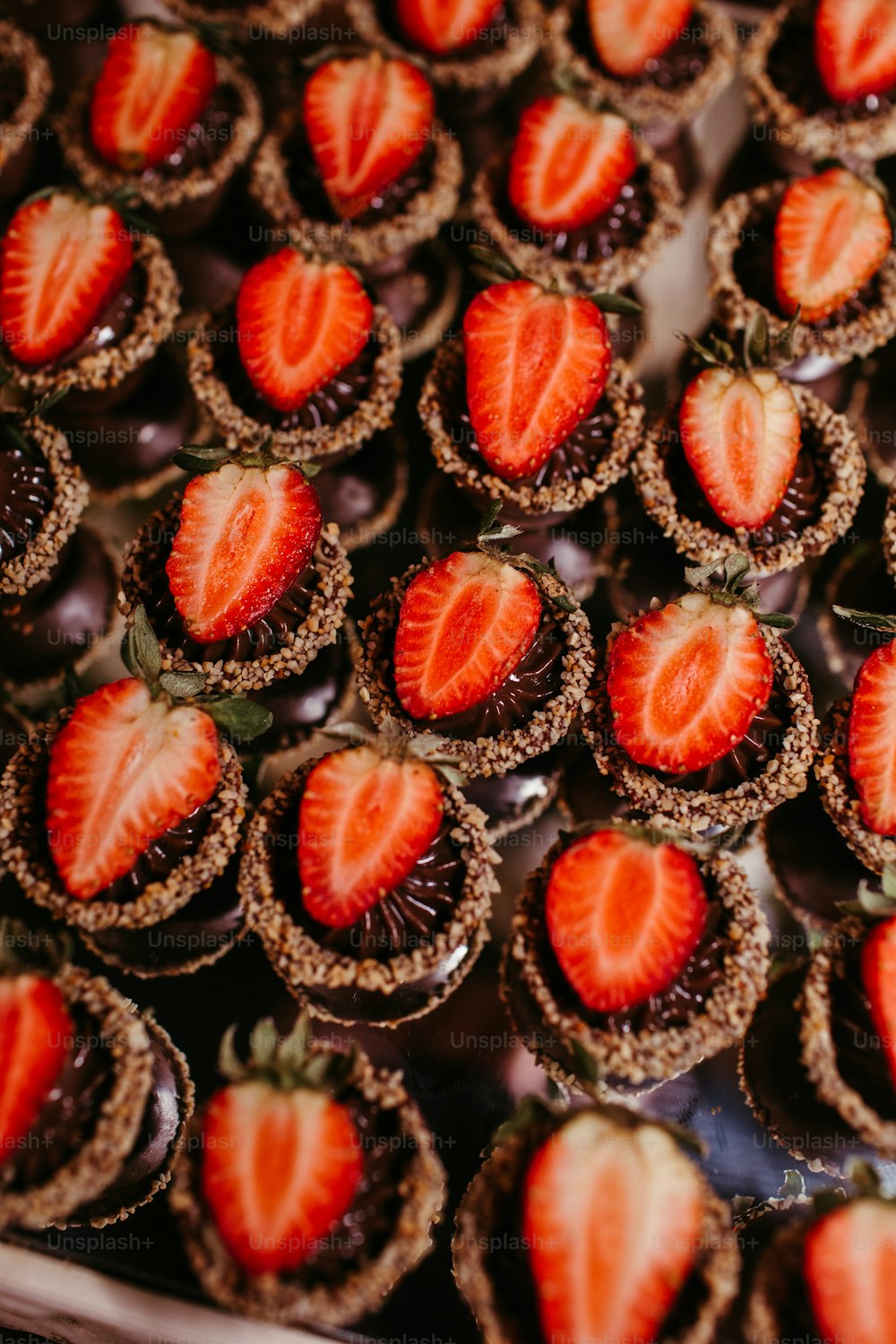 a close up of a tray of strawberries