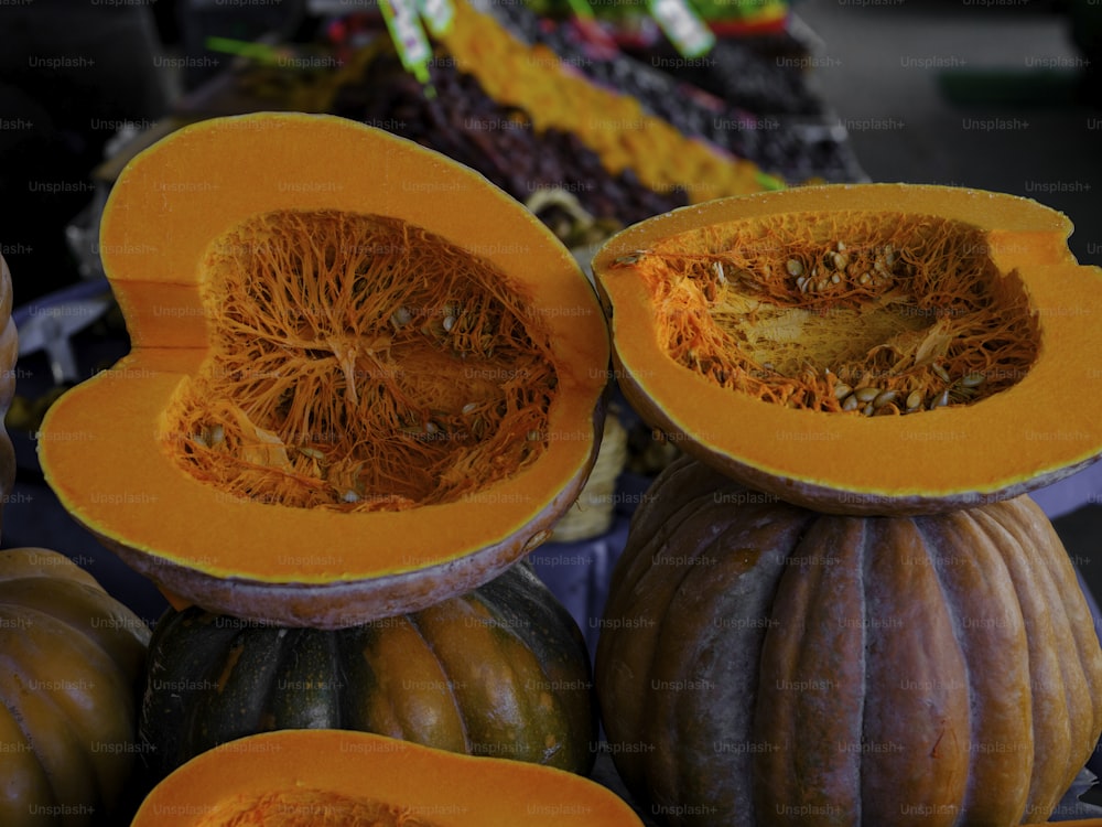 a close up of pumpkins and squash on display