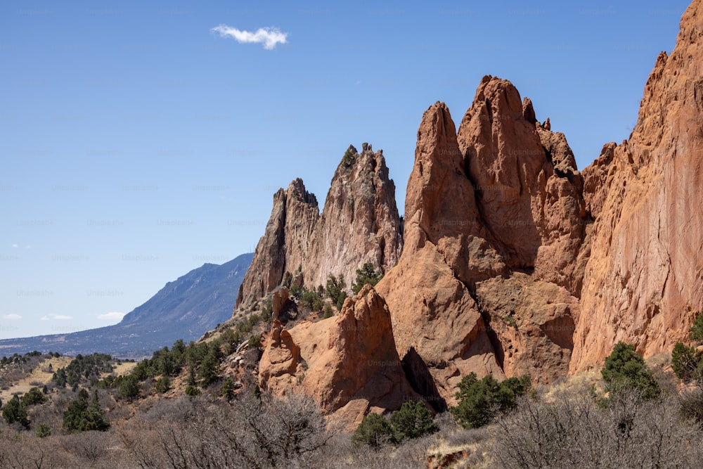 a group of large rocks in the middle of a desert