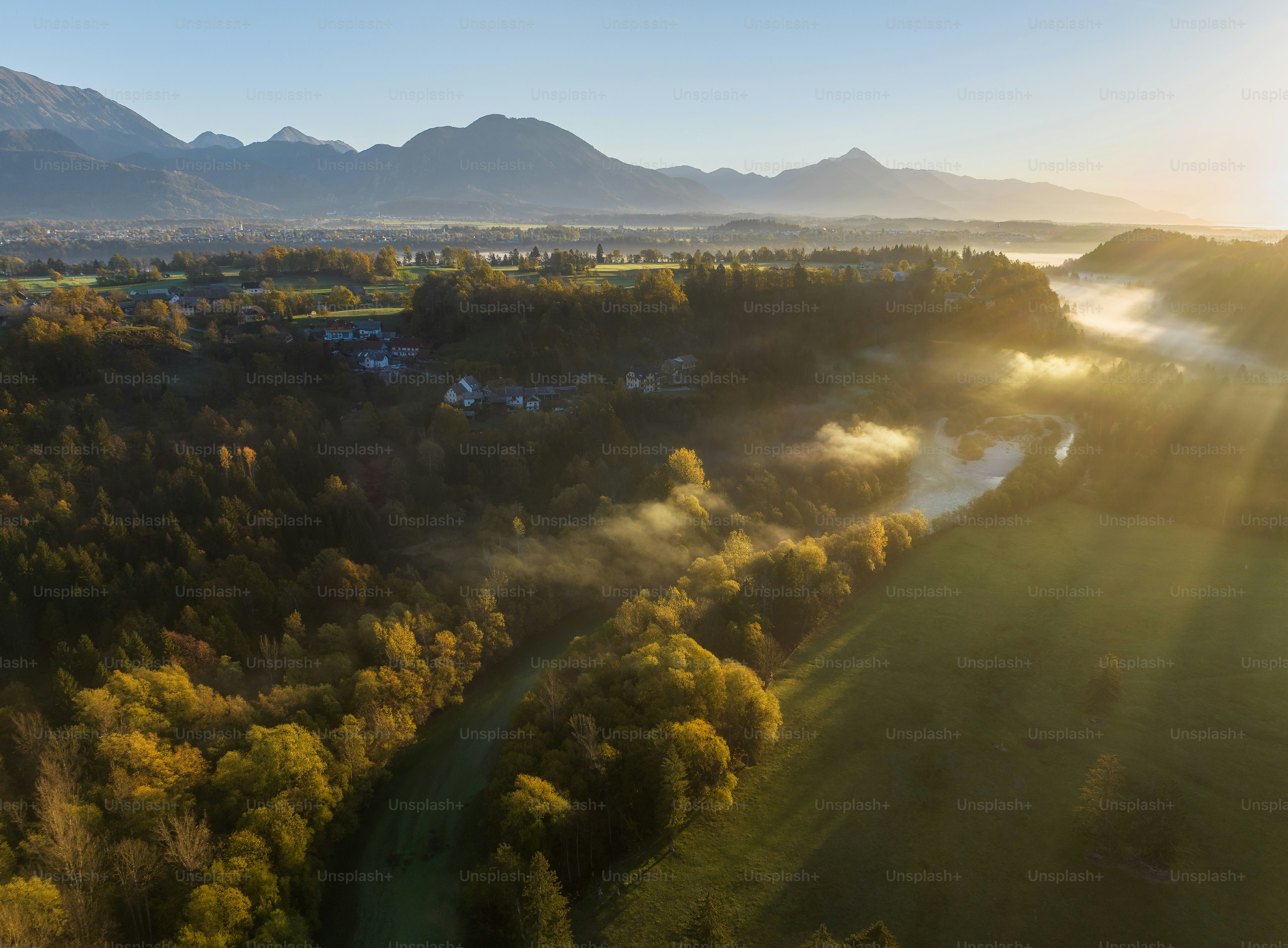 an aerial view of a valley with a river running through it