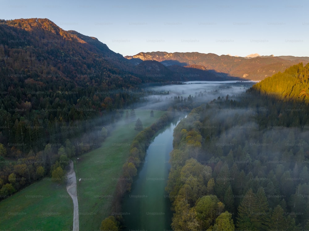 an aerial view of a river surrounded by mountains