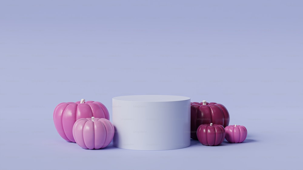 a group of pink candles sitting on top of a table