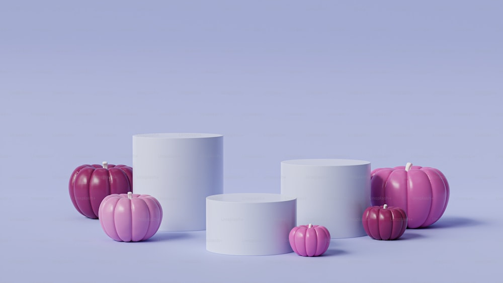 a group of three white vases sitting next to each other