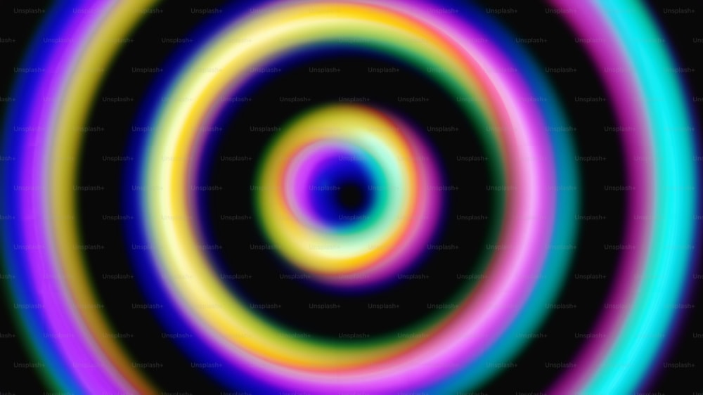 a multicolored circular pattern with a black background