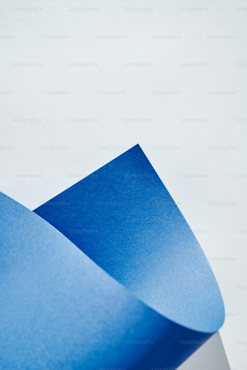 a close up of a blue piece of paper