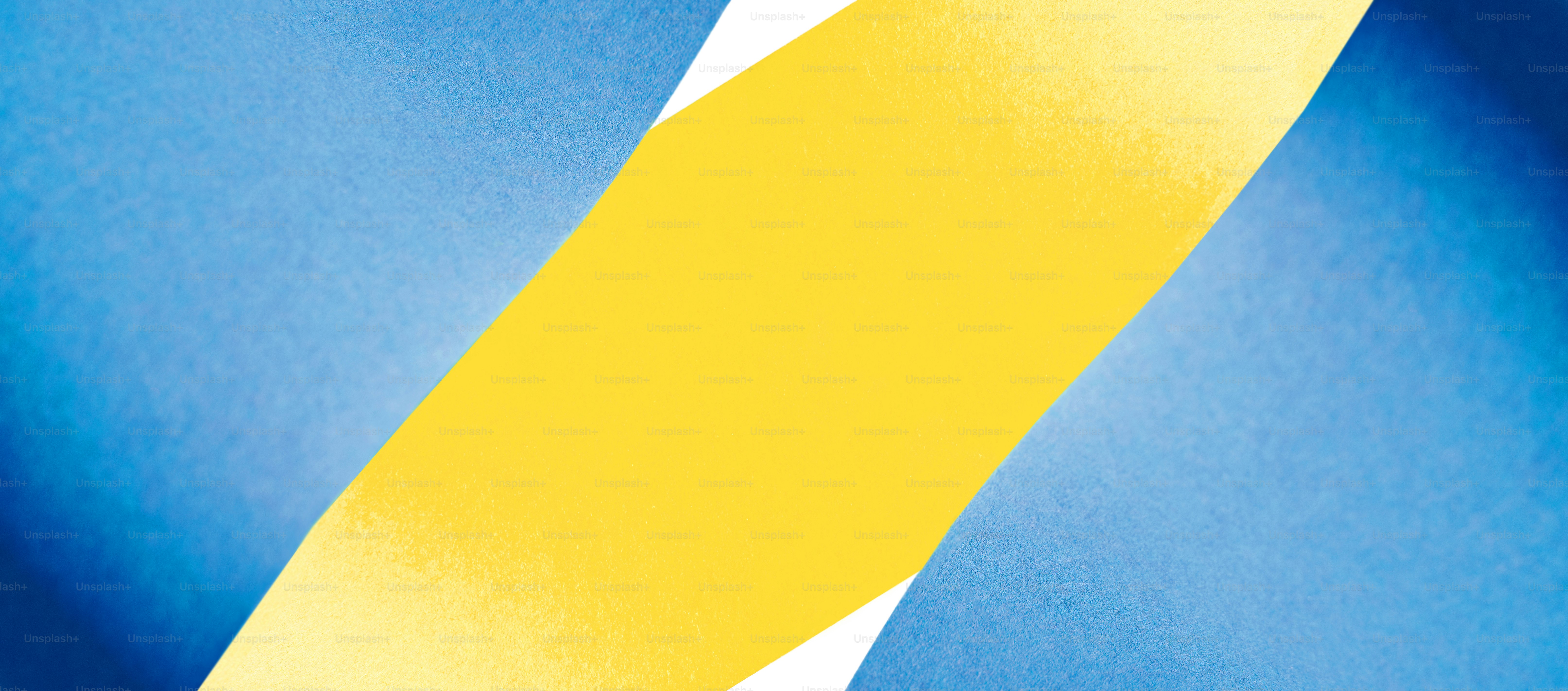 a close up of a blue and yellow background