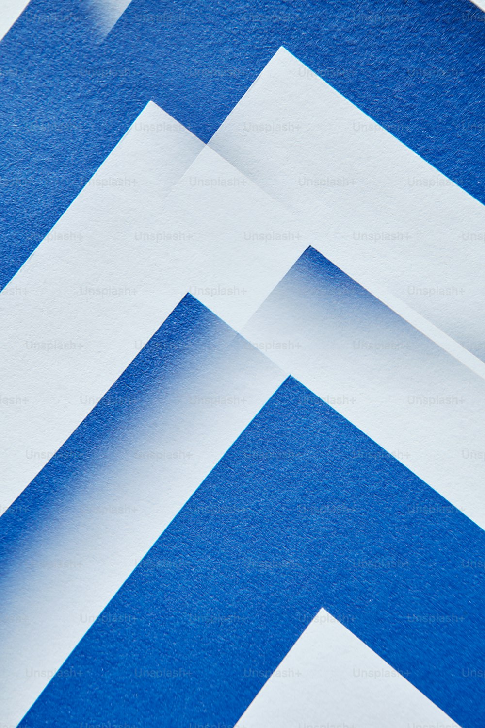 a close up of a blue and white wall