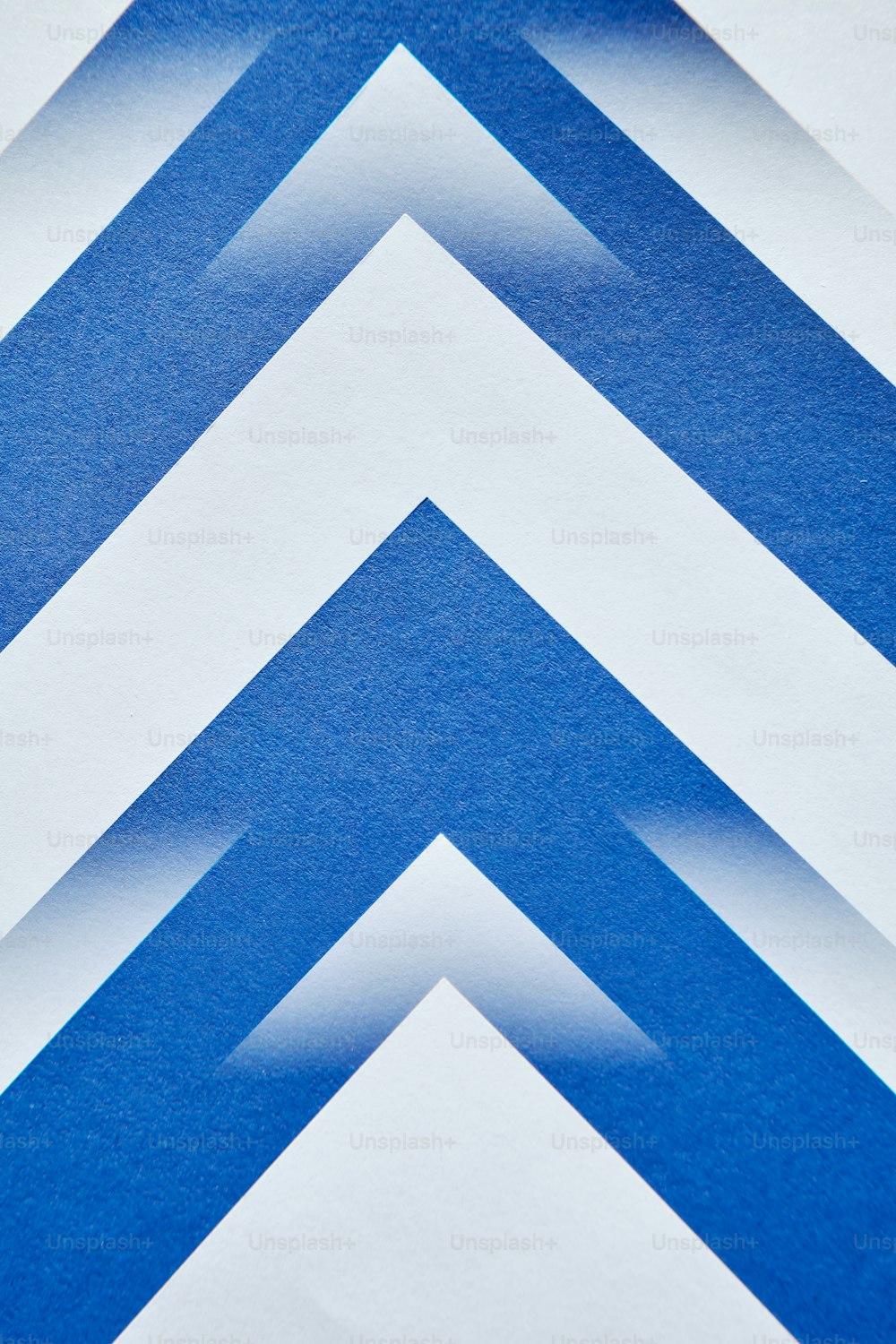a close up of a blue and white striped wall