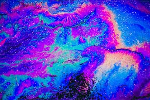 an abstract painting of blue, purple, and pink