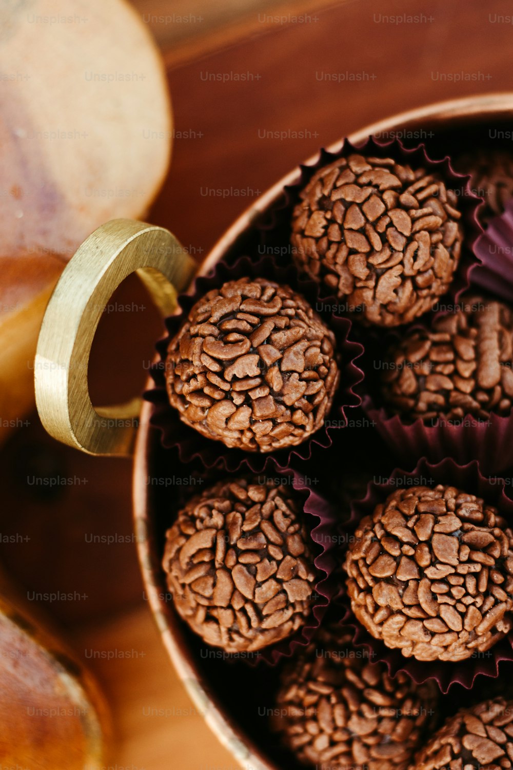 a bowl filled with chocolate cookies next to a banana