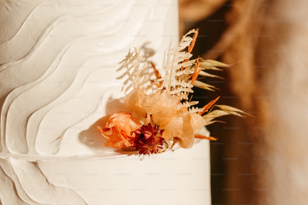 a close up of a white cake with flowers on it