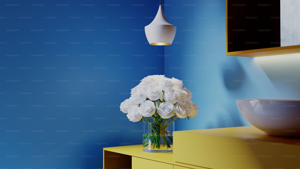 a vase filled with white flowers sitting on top of a yellow dresser