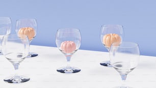 a group of wine glasses sitting on top of a table