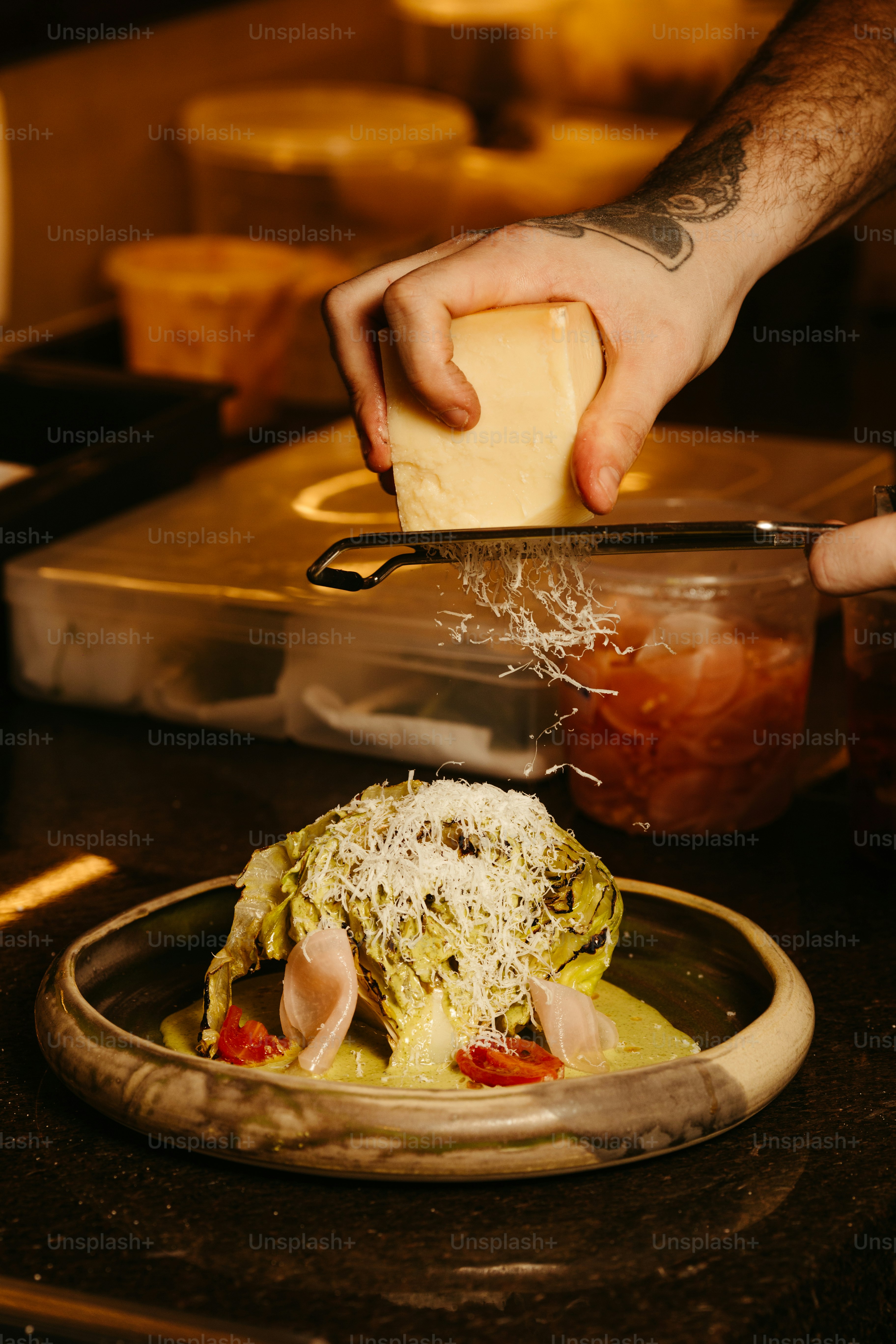 a person cutting up a piece of food on a plate