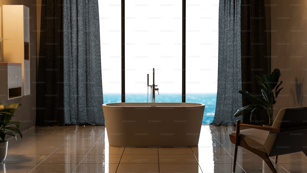 un bagno con una grande finestra e una vasca da bagno