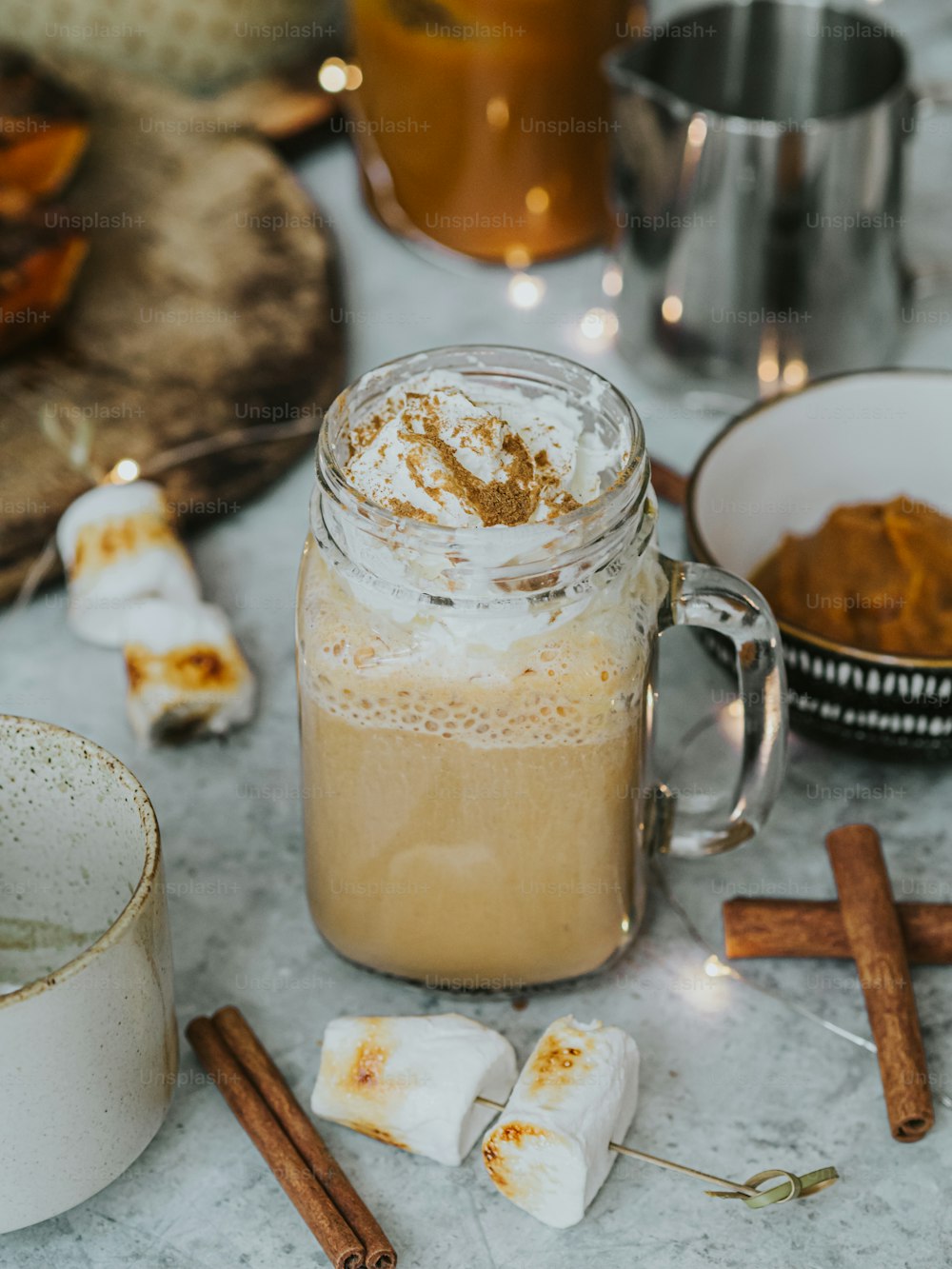 a cup of coffee sitting on top of a table