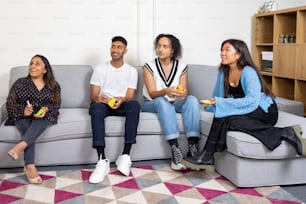 a group of people sitting on top of a couch