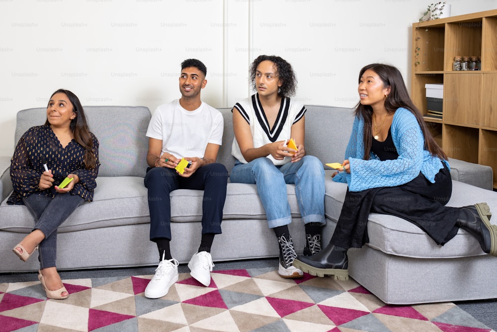 a group of people sitting on top of a couch