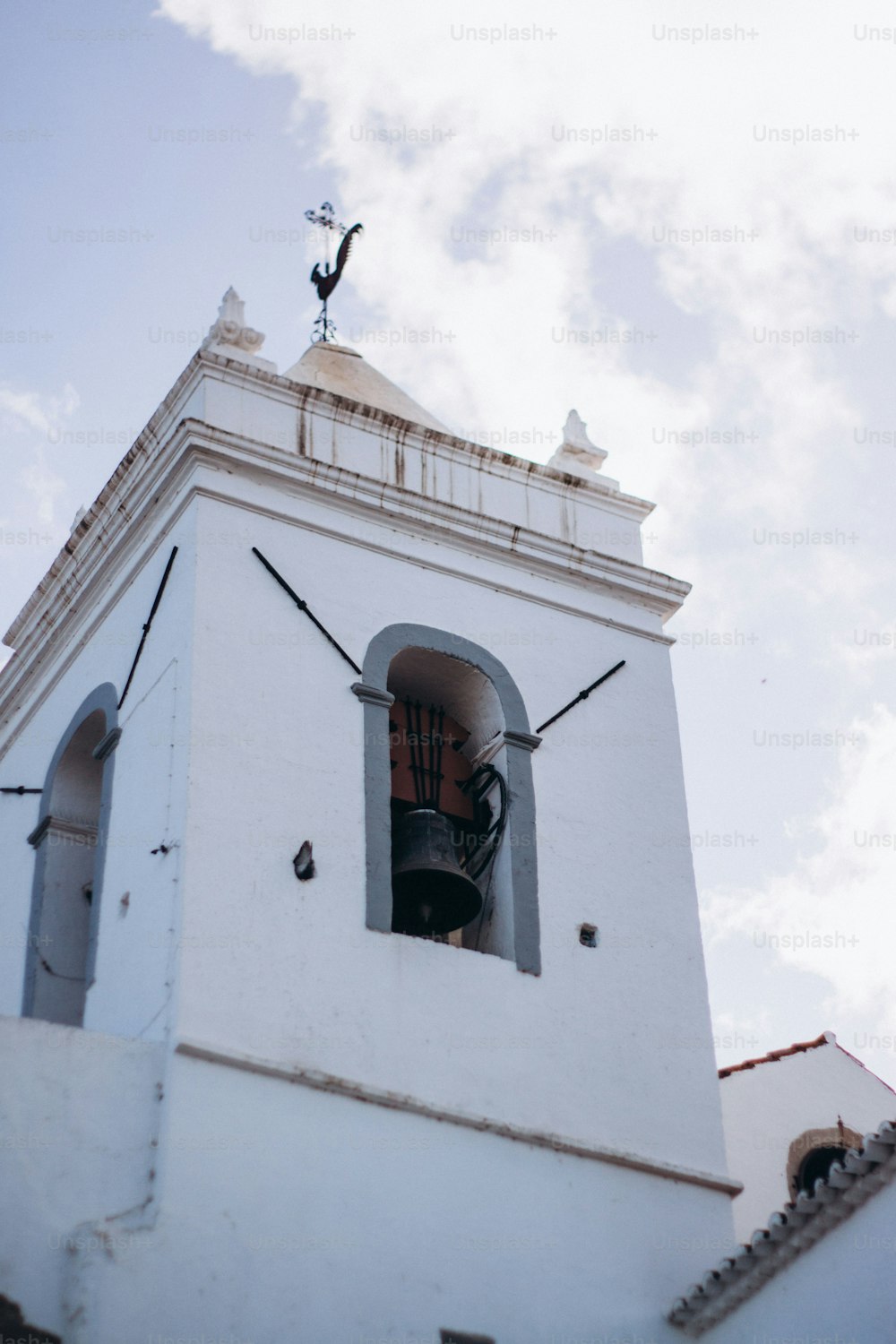 a bell tower with a bell on top of it