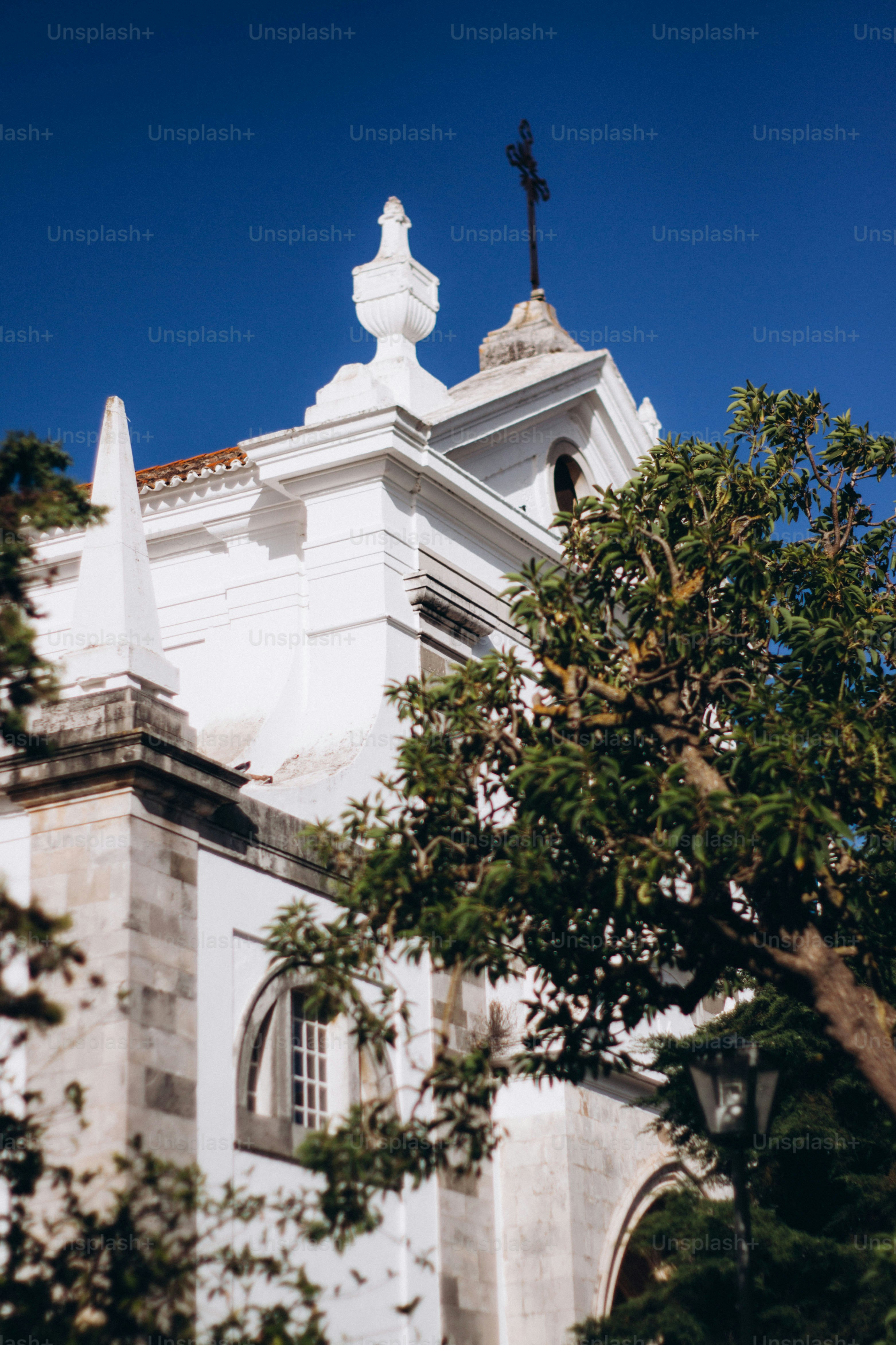 a white church with a cross on top of it