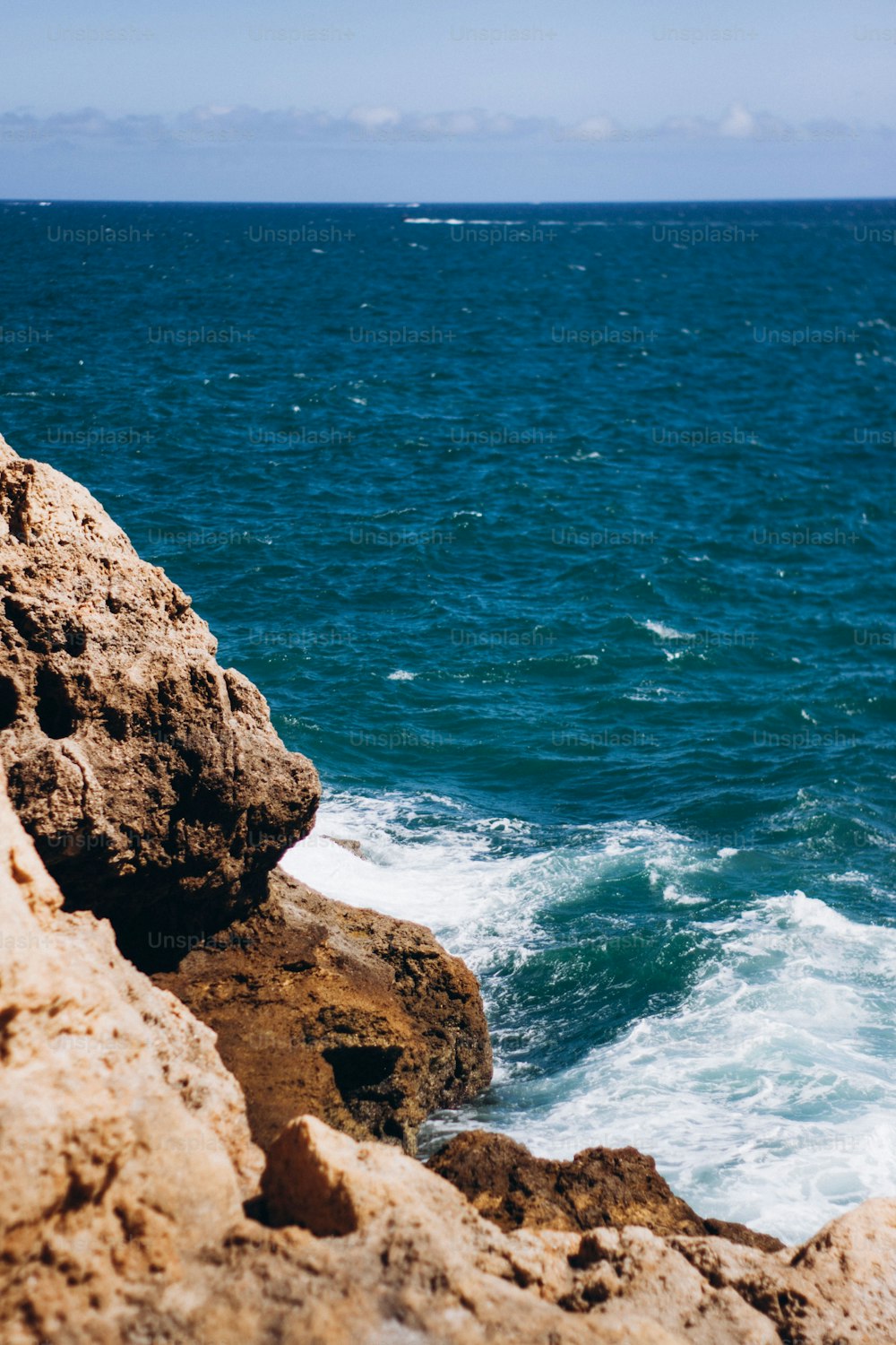 a person riding a surfboard on top of a wave