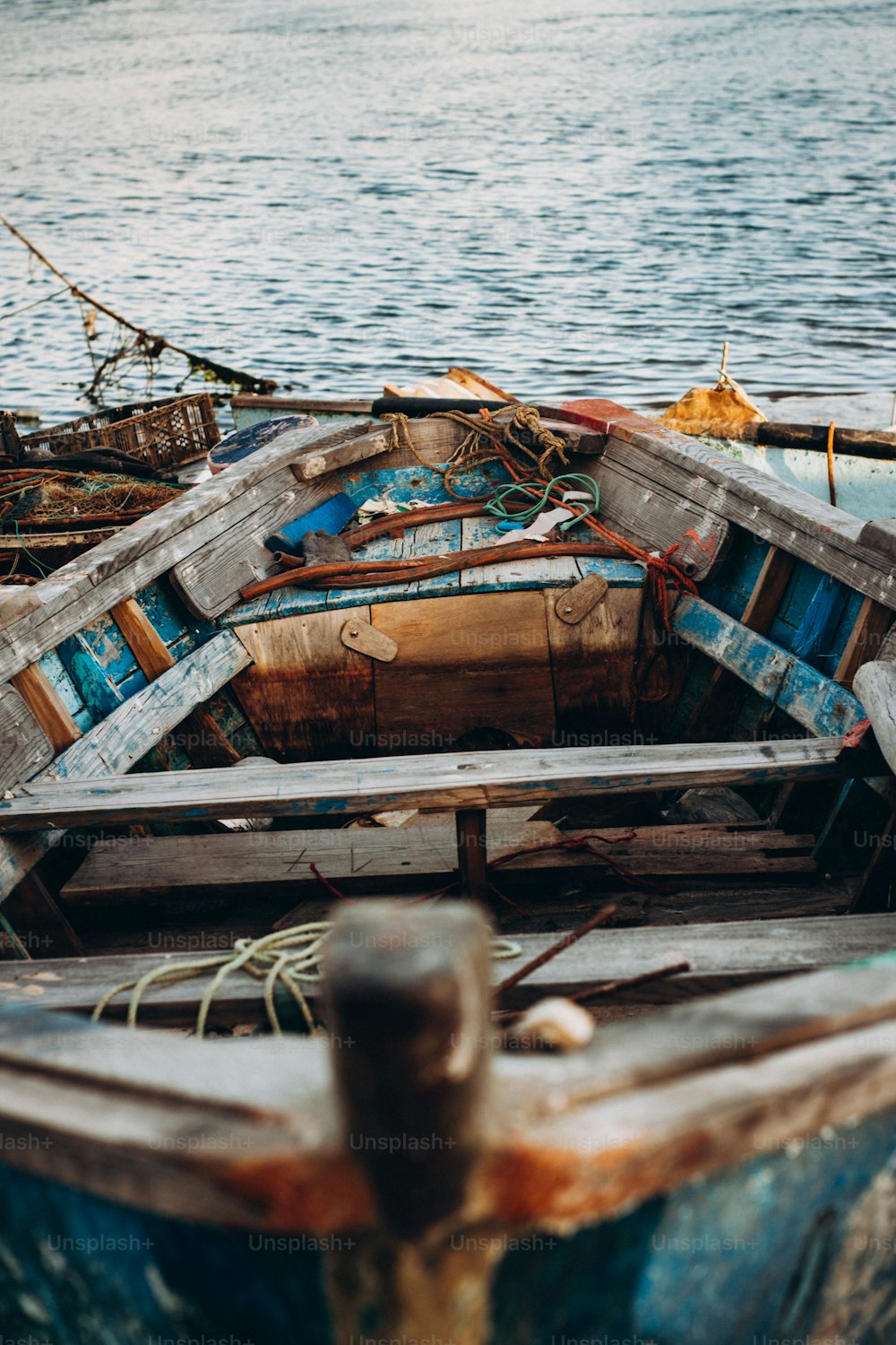 a wooden boat sitting on top of a body of water