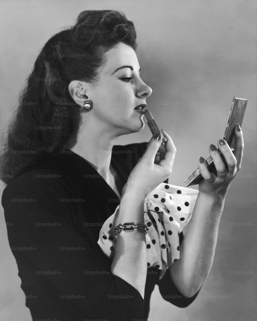 a woman holding a cell phone to her ear