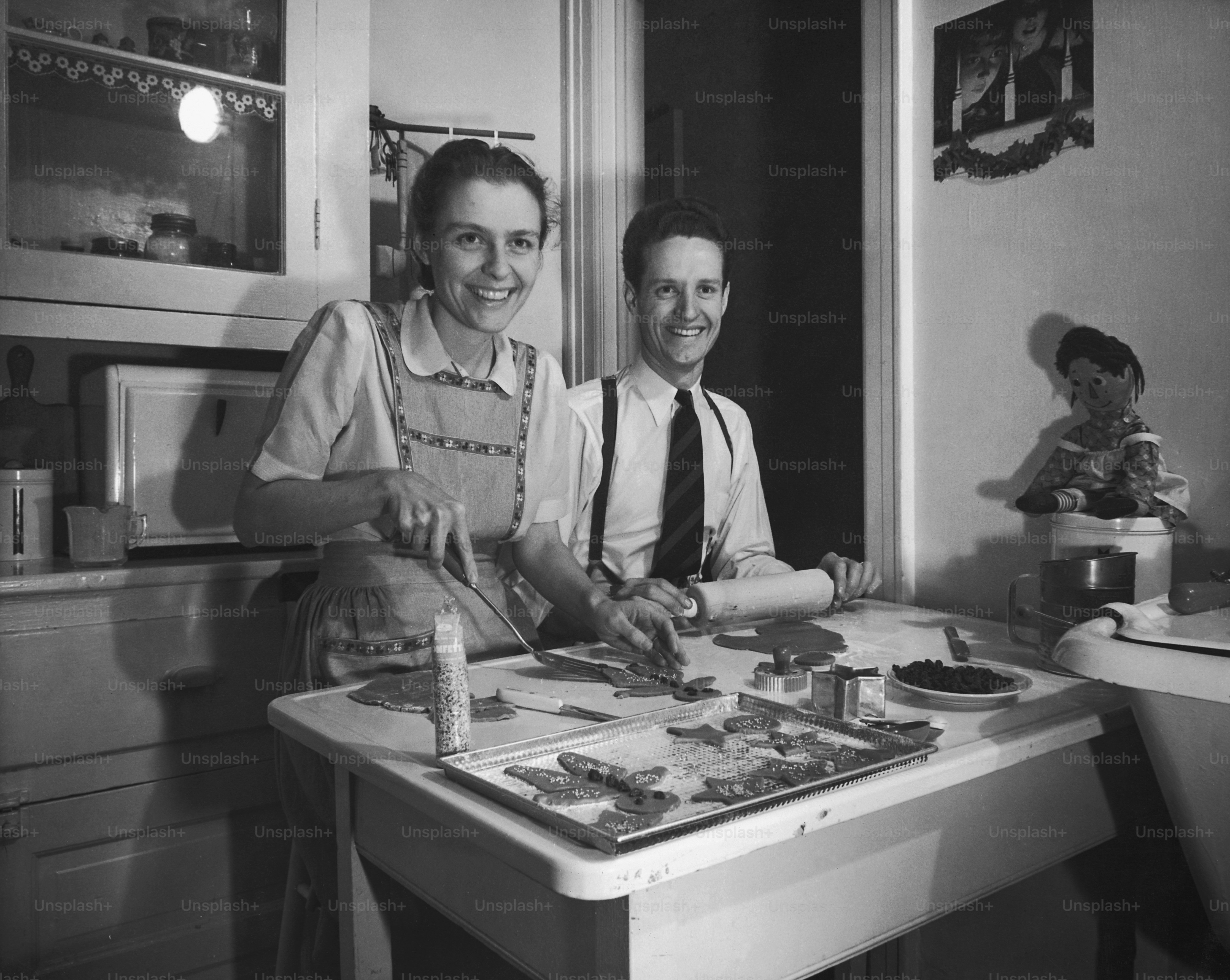 a couple of people that are standing in front of a table