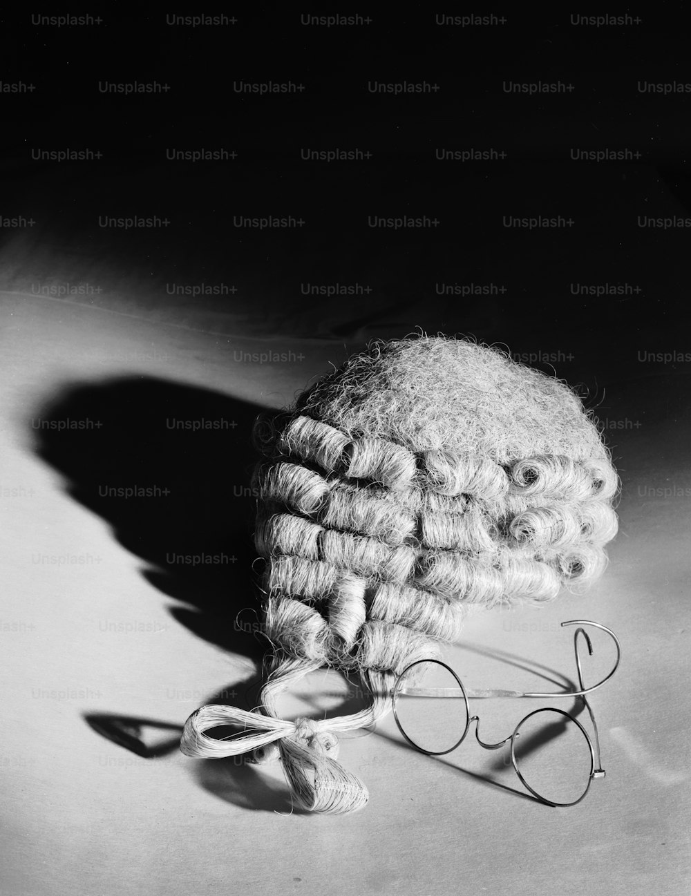 31st August 1962:  A barrister's wig and steel rimmed spectacles.  (Photo by Chaloner Woods/Getty Images)