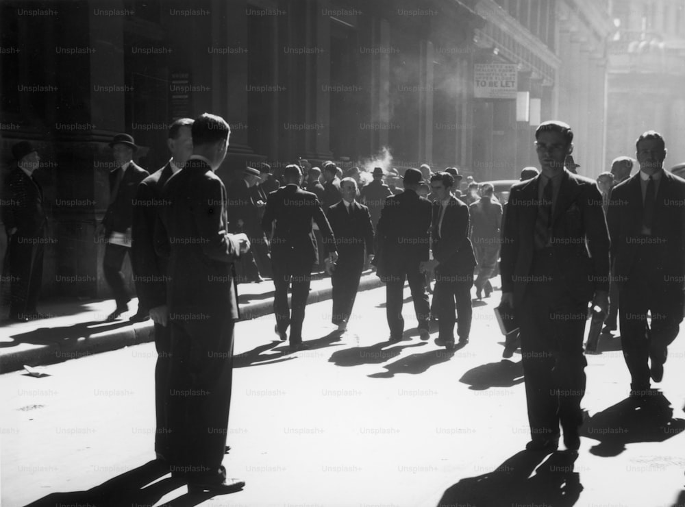 circa 1938:  City workers walking along Throgmorton Street in the financial district of London.  (Photo by Chaloner Woods/Getty Images)