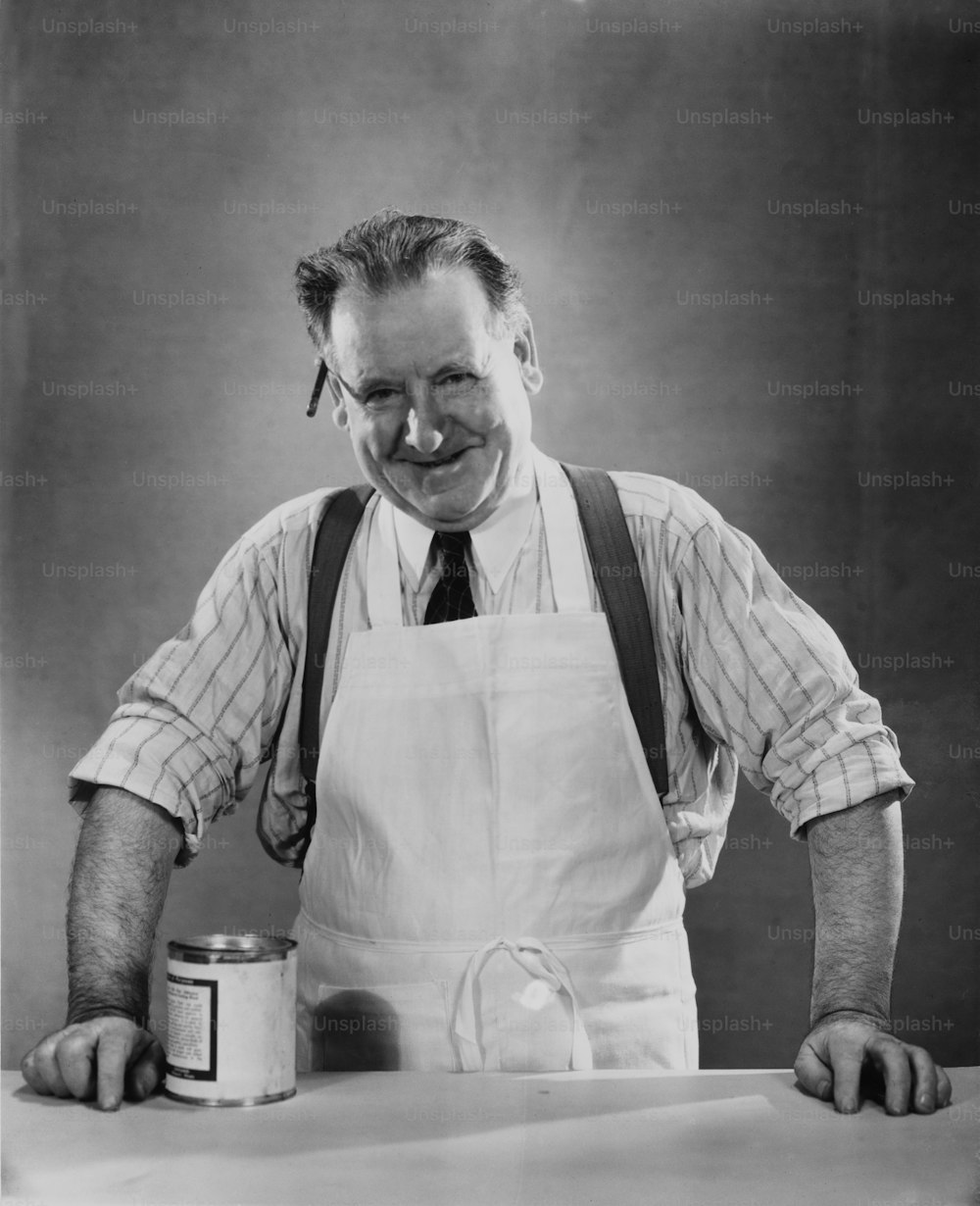 A shopkeeper with a tin of food, circa 1940.  (Photo by George Marks/Retrofile/Getty Images)