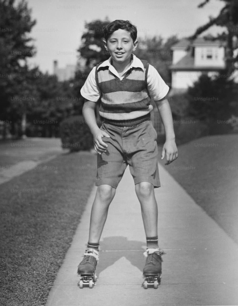 A boy roller skating down a path on a suburban street. (Photo by George Marks/Retrofile/Getty Images)