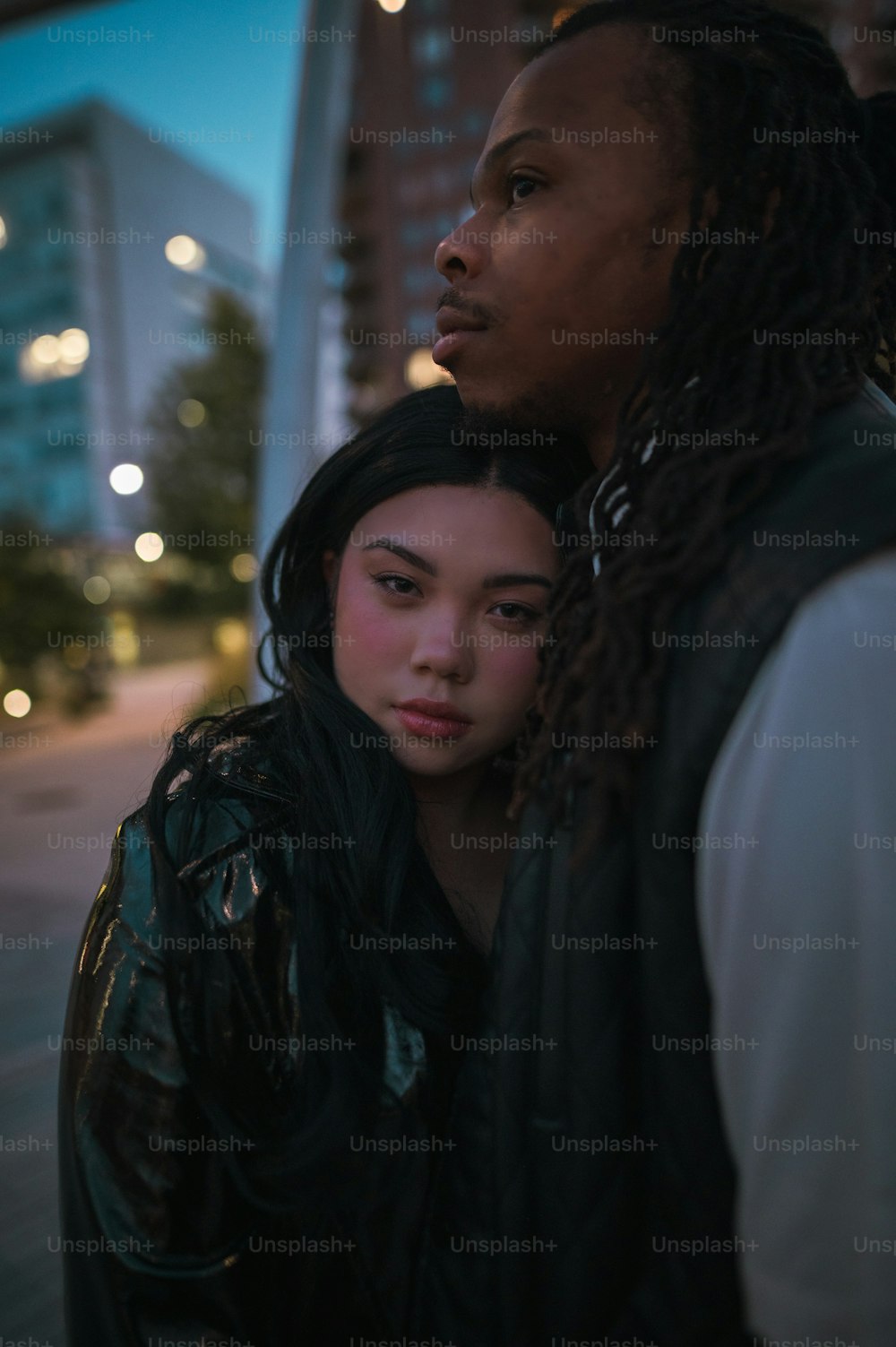 a man and a woman standing next to each other