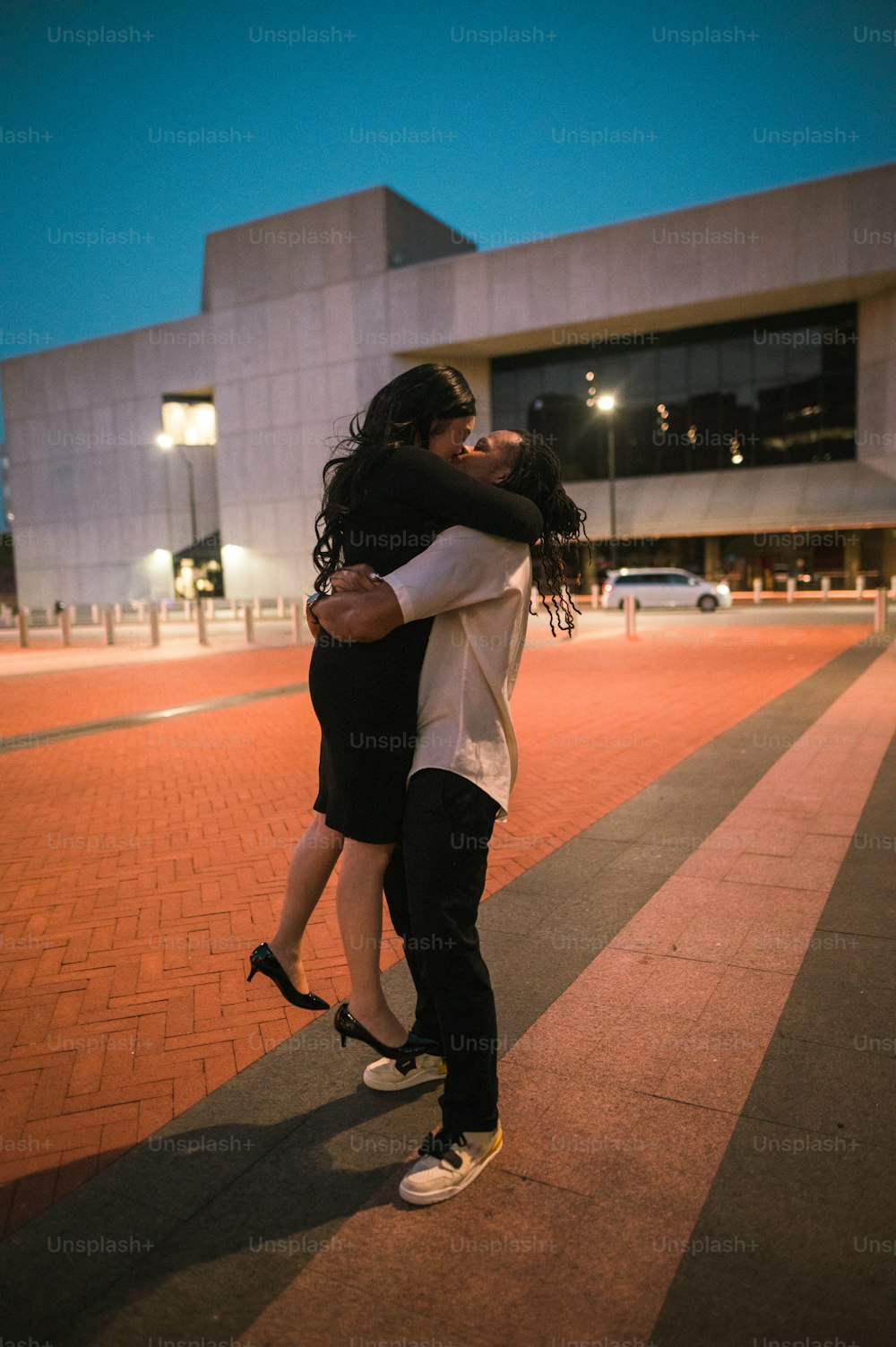 a couple of people that are hugging each other