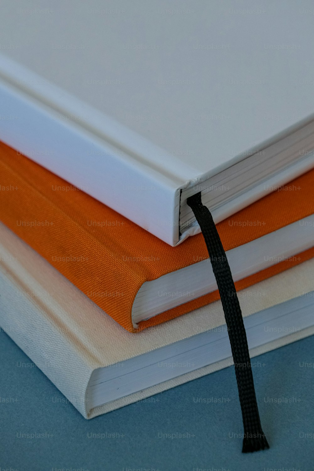 a close up of a book with a black ribbon