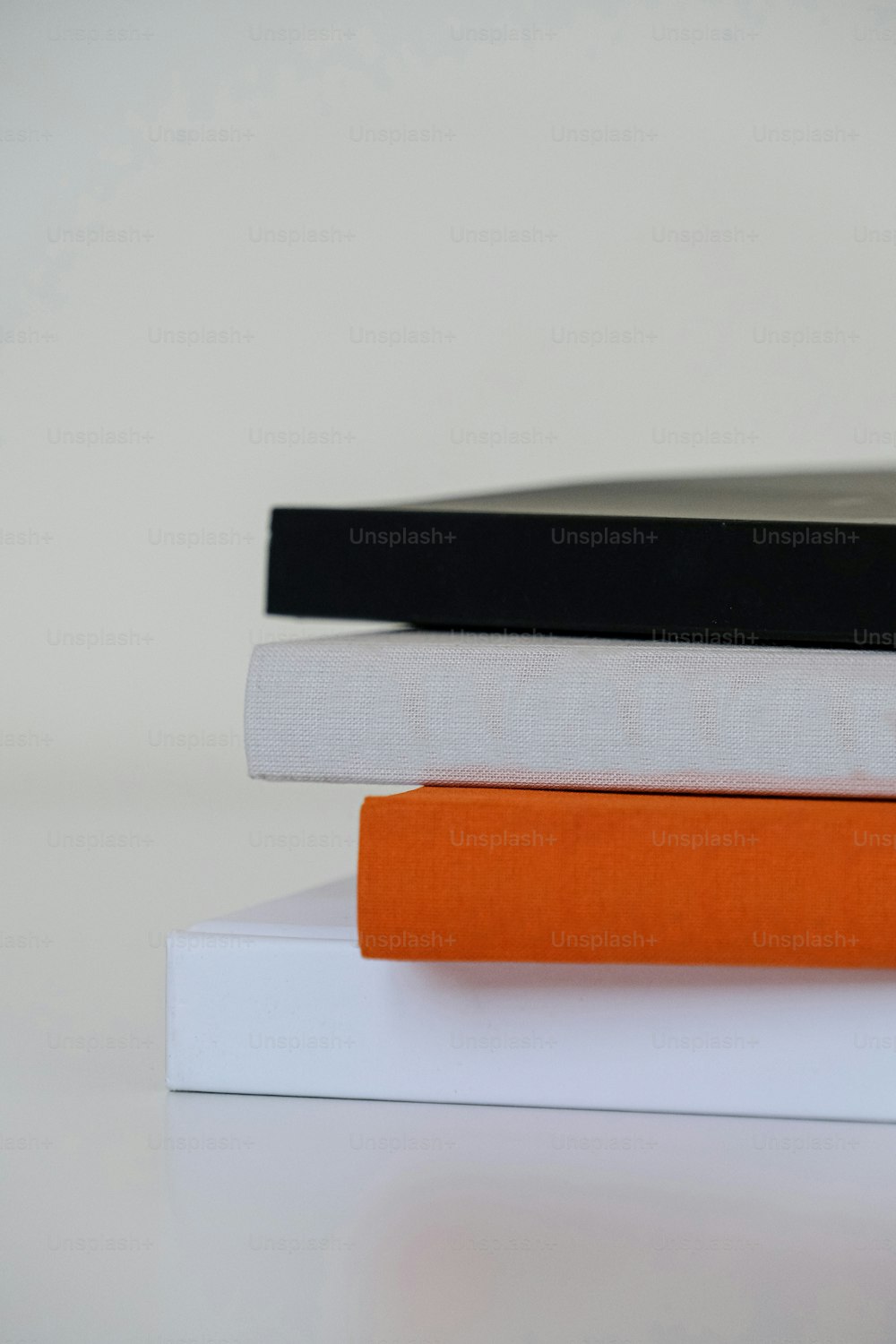 a stack of three books sitting on top of each other