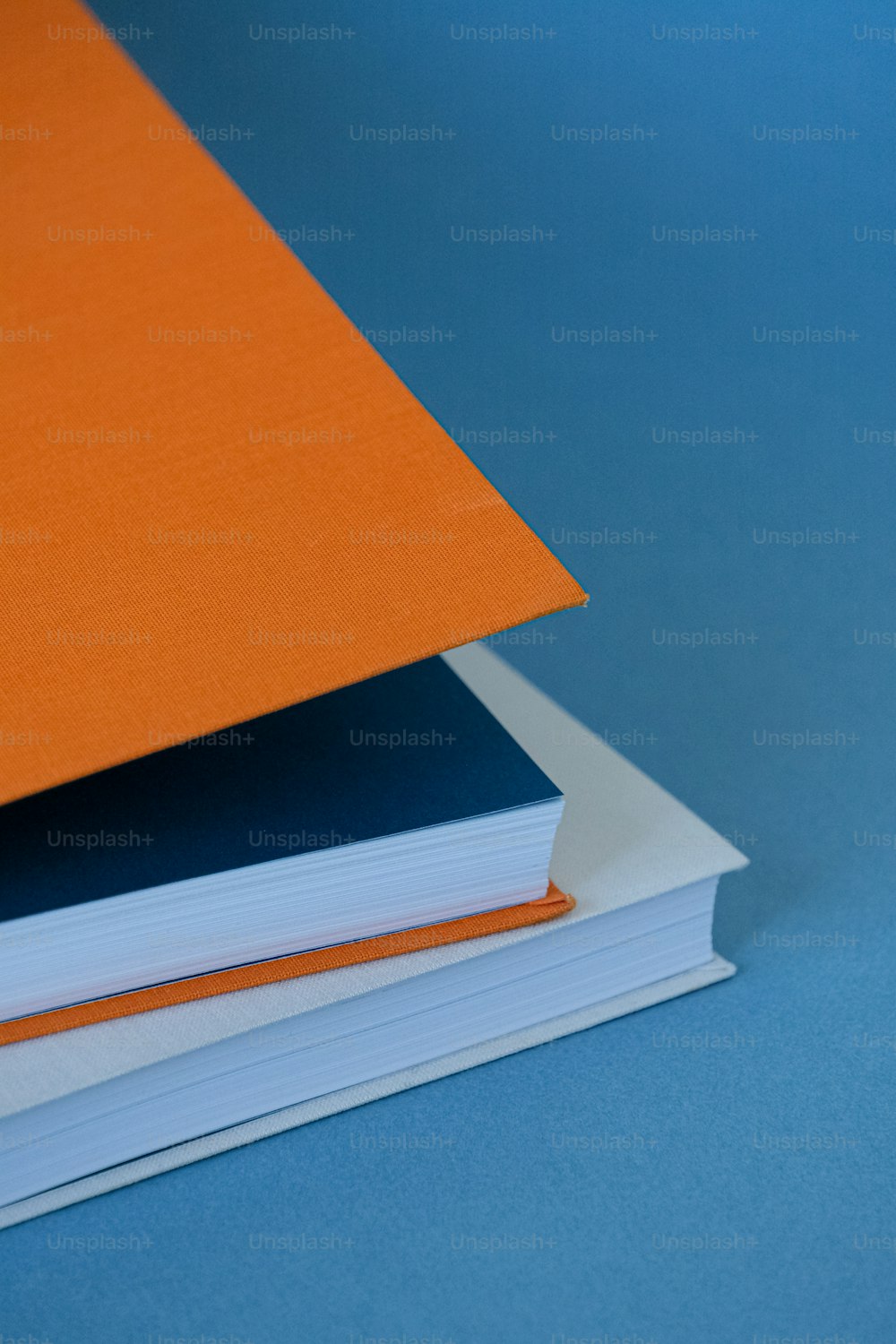 blue and orange book stack