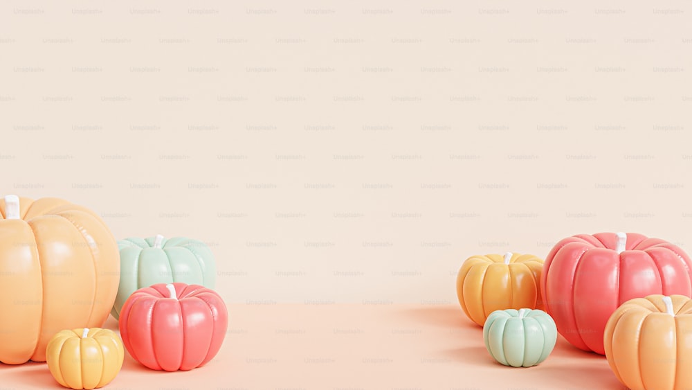a group of fake pumpkins sitting on top of a table