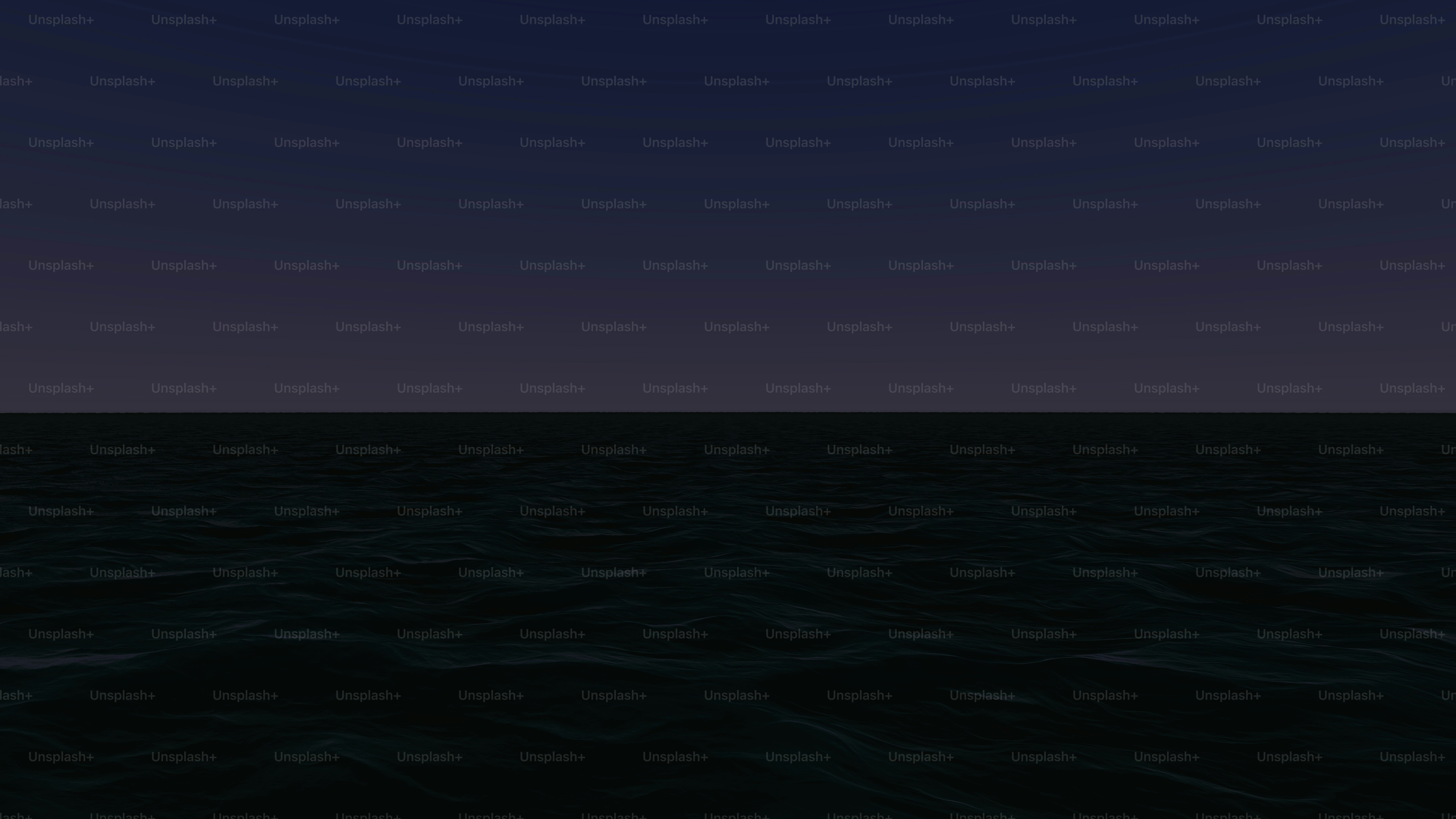 a view of the ocean at night from a boat