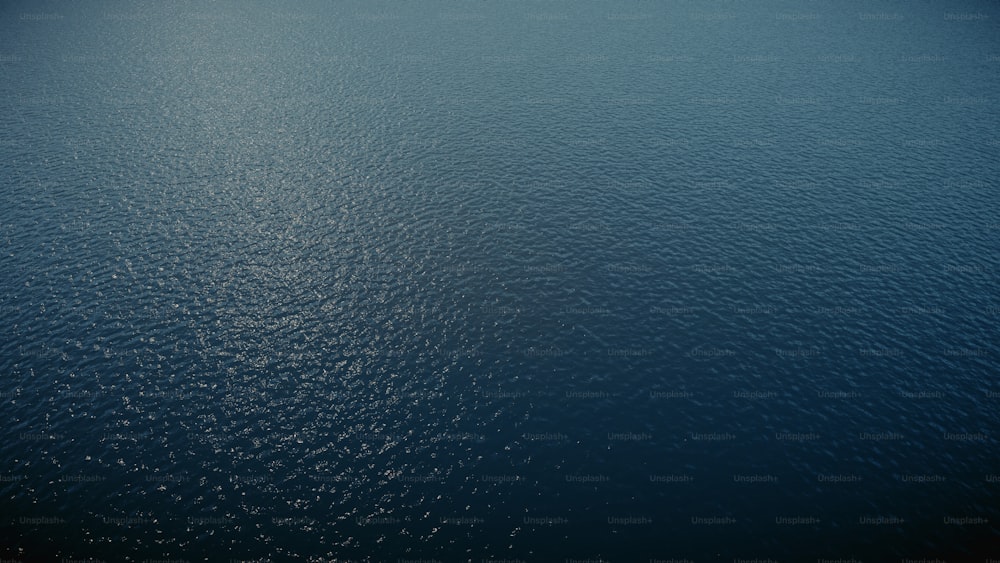 a large body of water with a sky background