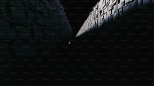 a dark alley with a green light at the end