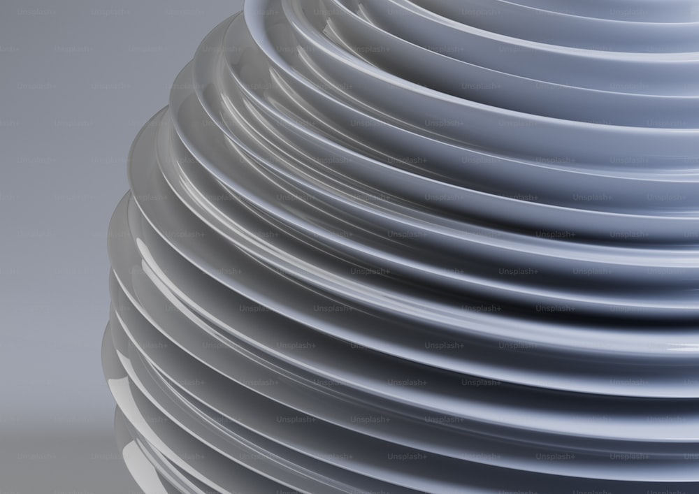 a stack of white plates stacked on top of each other