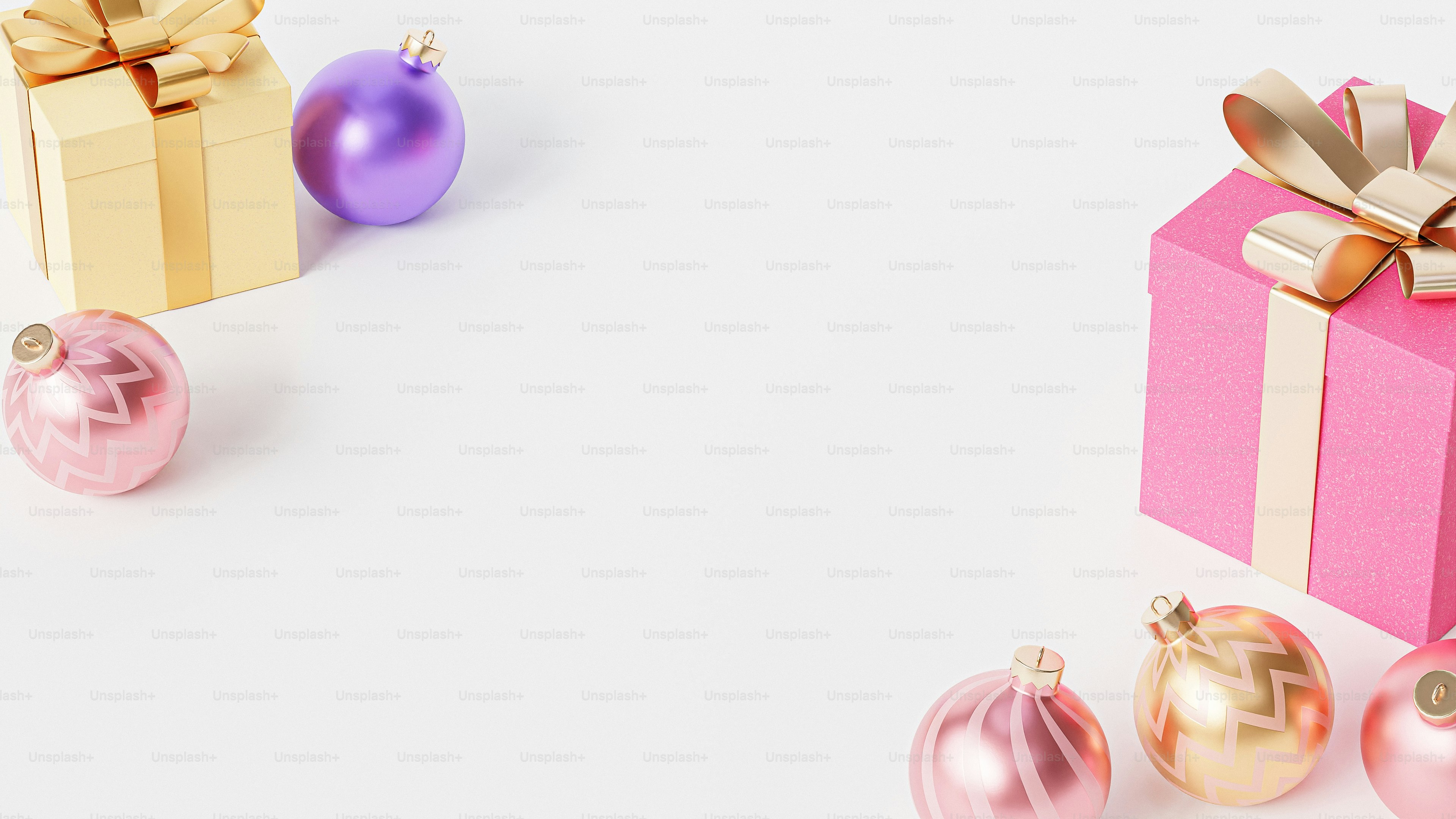 una confezione regalo rosa con nastro d'oro e ornamenti