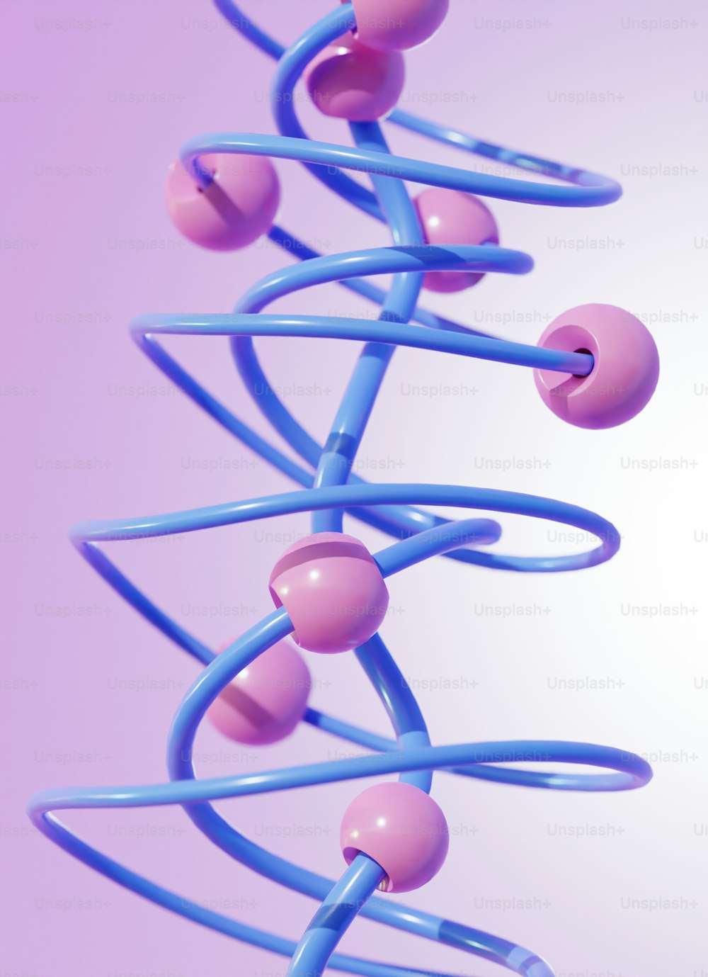 a bunch of blue and pink balls hanging from a string